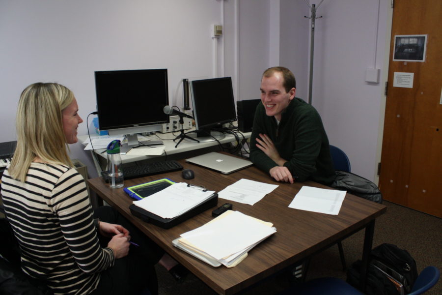 Student clinician working with a client on a voice exercise.