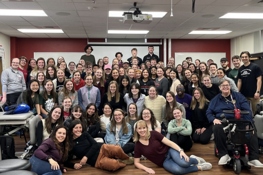Group photo of our speech-language graduate students and UW physical and occupational therapy students. They work together as a team to develop plans and co-treat underserved and/or under/uninsured patients who need physical, occupational and speech therapy interventions in neurological rehabilitation.