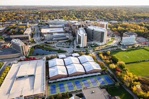 The medical complex on the west side of campus featuring UW Hospitals and Clinics is pictured in an aerial view of the University of Wisconsin–Madison campus during a sunny autumn day on Oct. 22, 2023. Clockwise from bottom, major campus buildings include the Nielsen Tennis Stadium, Rennebohm Hall, Signe Skott Cooper Hall, the Health Sciences Learning Center, University Hospital, Wisconsin Institutes for Medical Research, American Family Children's Hospital, the Waisman Center and University Bay Fields. The aerial photograph was made from a helicopter looking south. Photo by Jeff Miller / UW–Madison