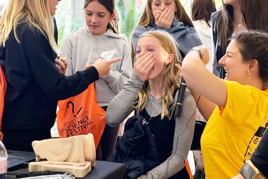Au.D. students use video otoscopy at the Wisconsin Science festival to show local middle school students a new view of their ears.