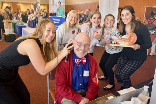 Audiology student clinicians provide hearing screenings at a senior health event under the supervision of our audiologists.