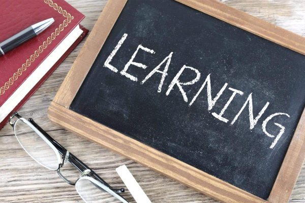 Chalkboard sign that says learning.