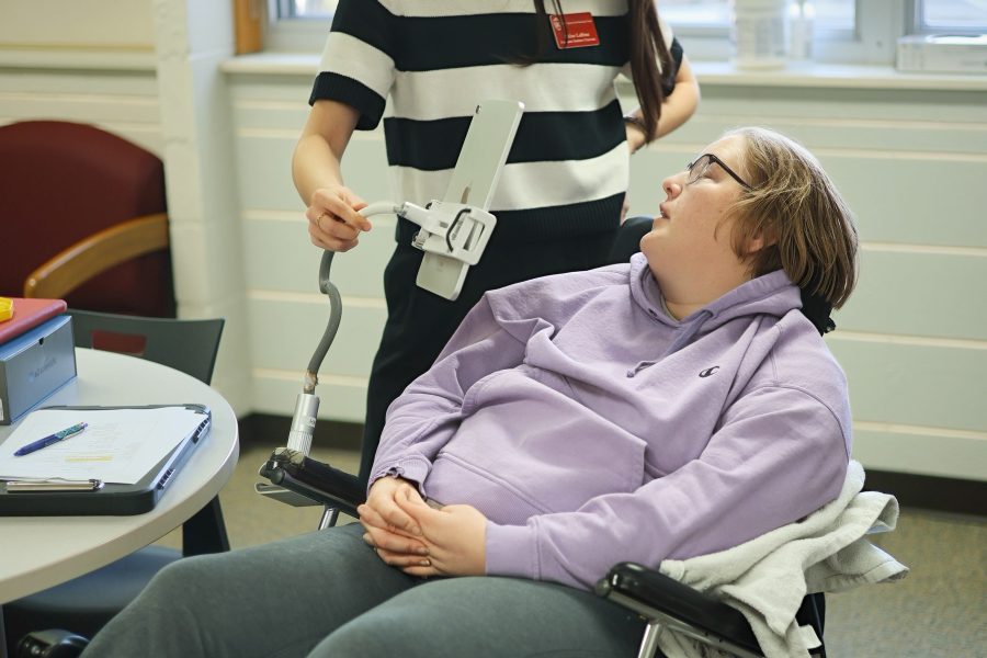A graduate student in speech-language pathology works with a client in the UW Speech and Hearing Clinic.